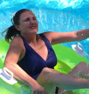 Kimberly jumping in the pool